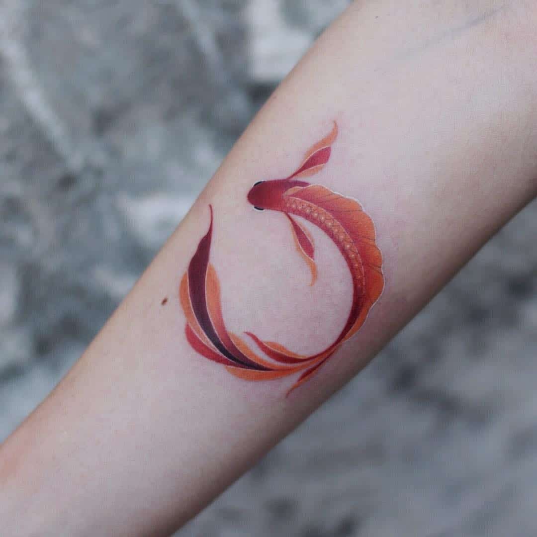 watercolor sea creature tattoo on arm