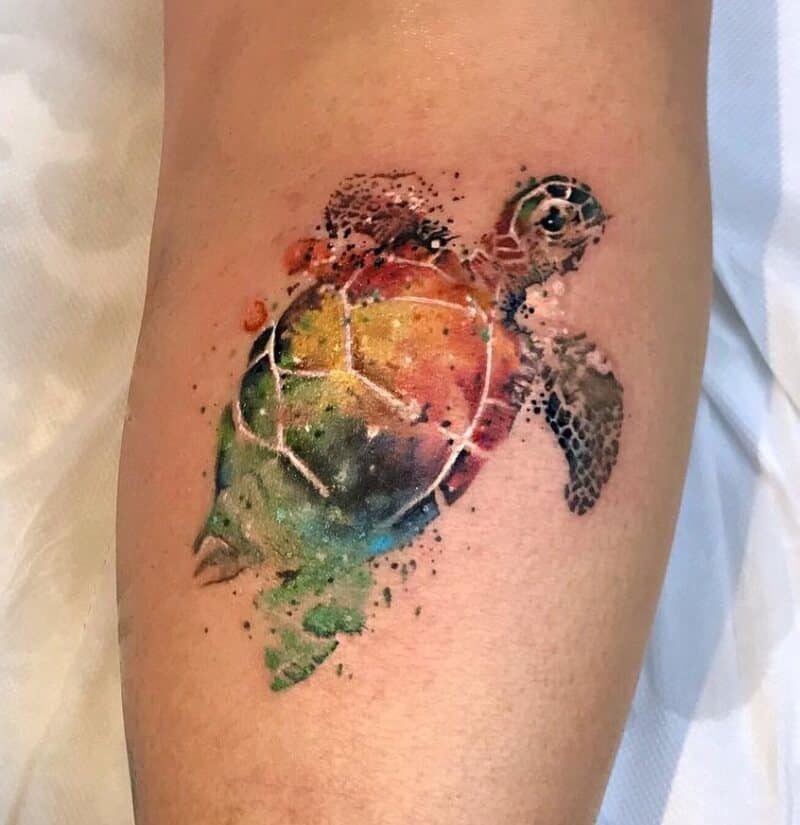 watercolor sea creature tattoo on arm