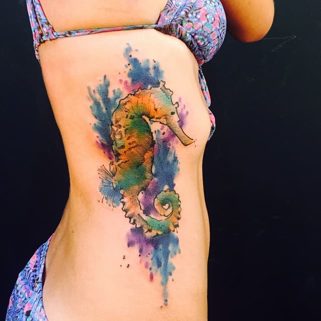 watercolor seahorse tattoo on rib