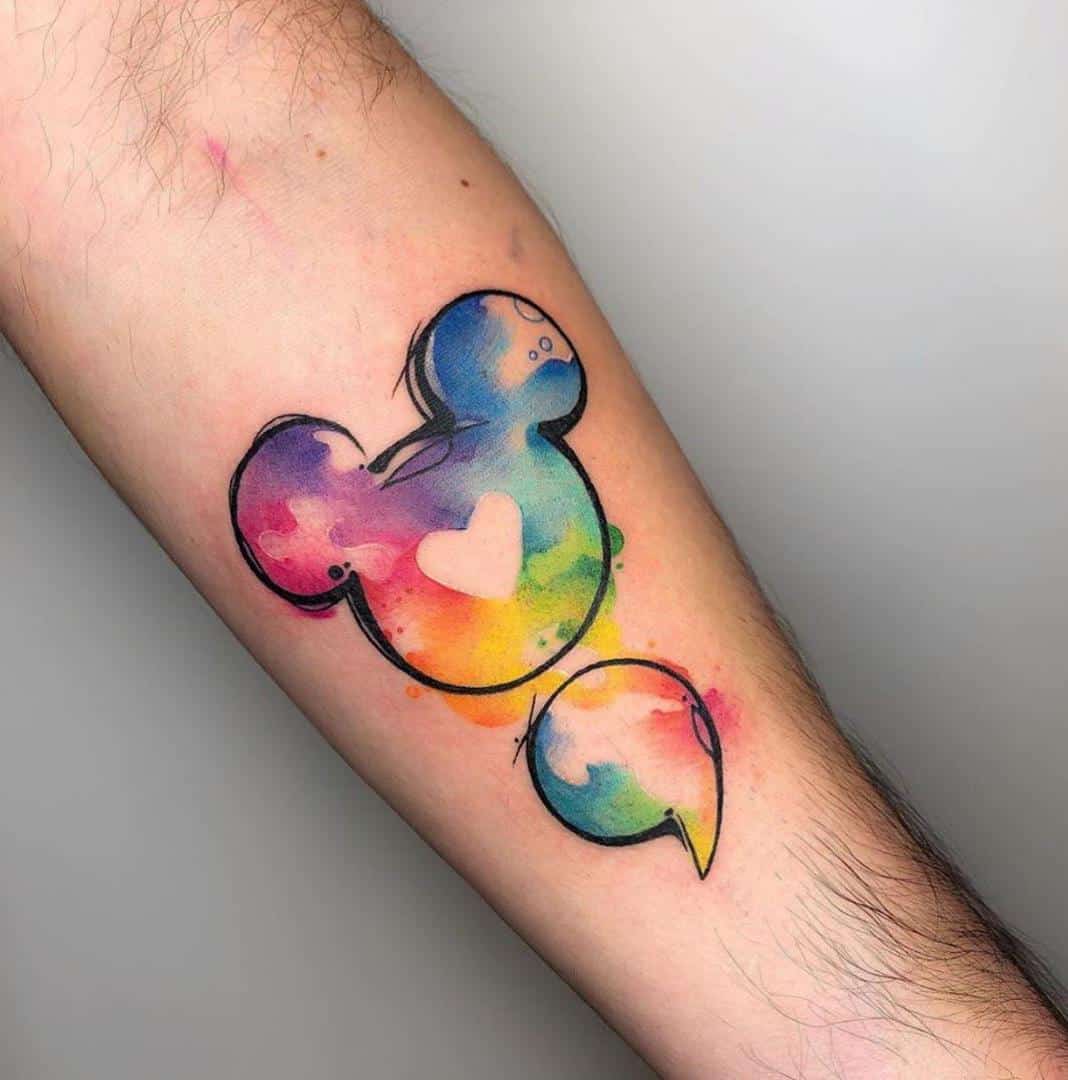 watercolor semicolon tattoo on arm