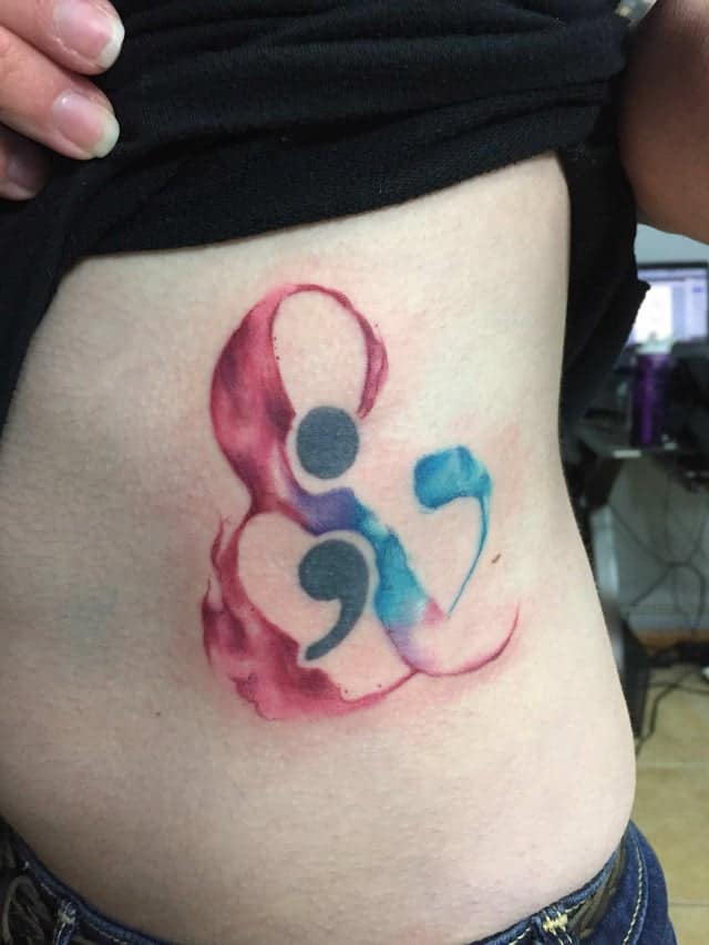 watercolor semicolon tattoo on rib