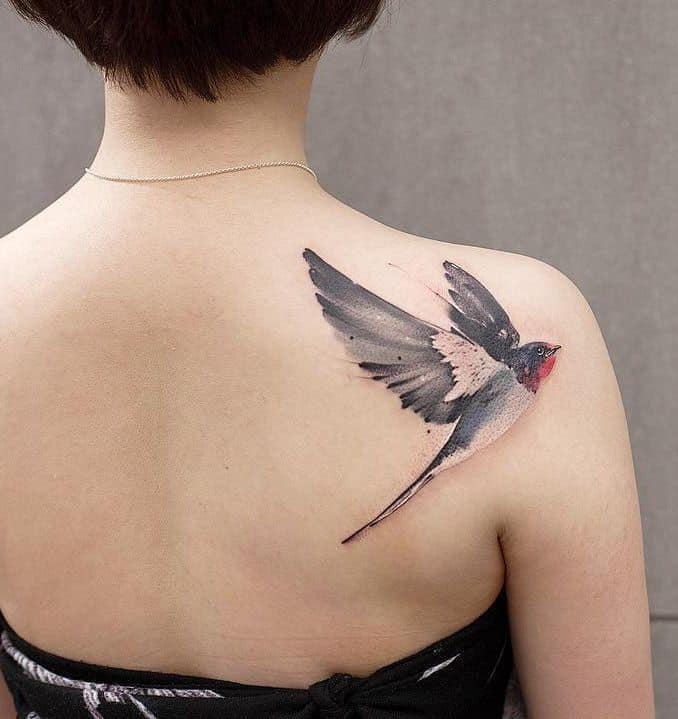 watercolor sparrow tattoo on shoulder