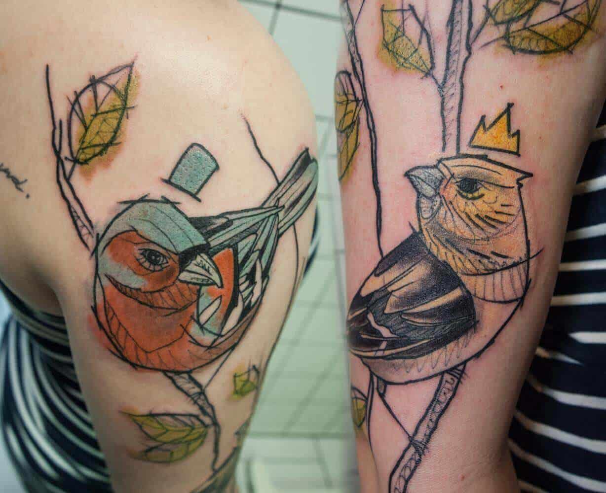 watercolor sparrow tattoo on arm