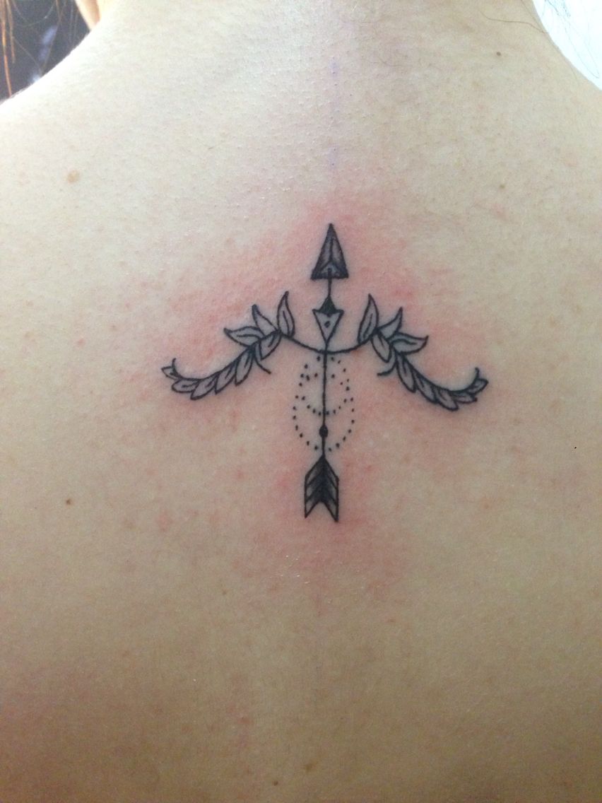arrow sagittarius tattoo on back
