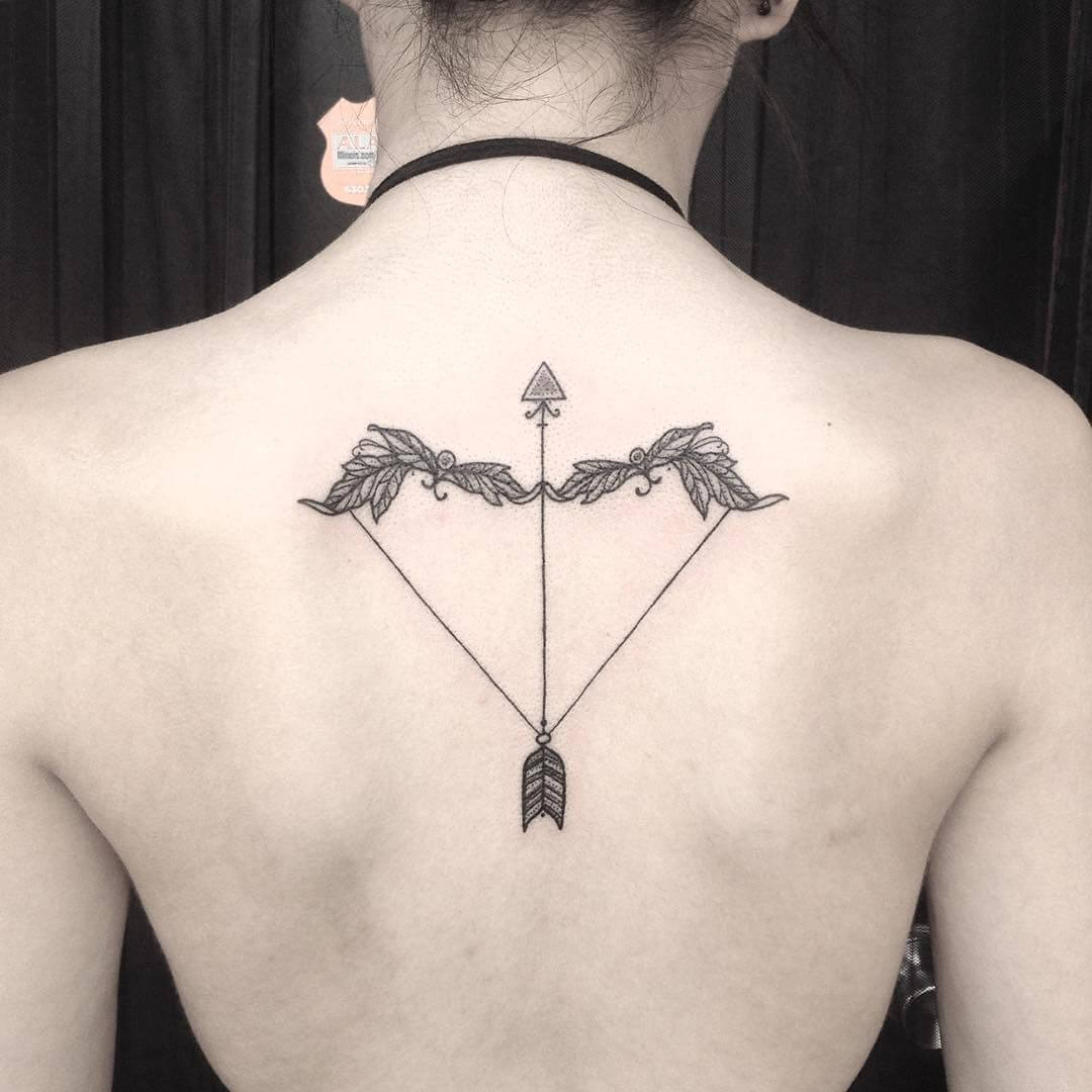 arrow sagittarius tattoo on back