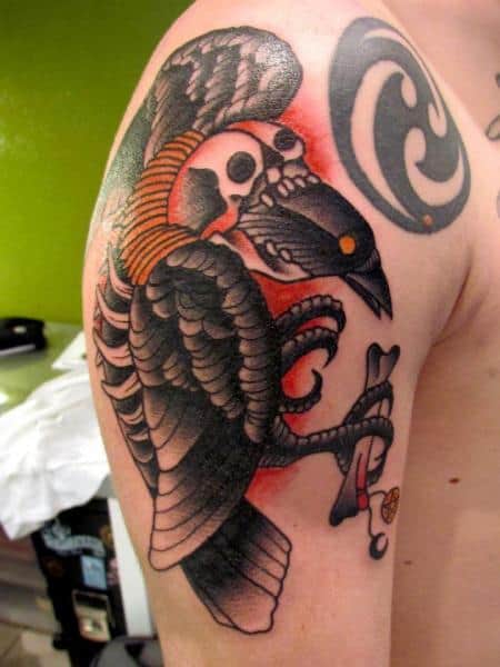 colored crow raven tattoo on arm