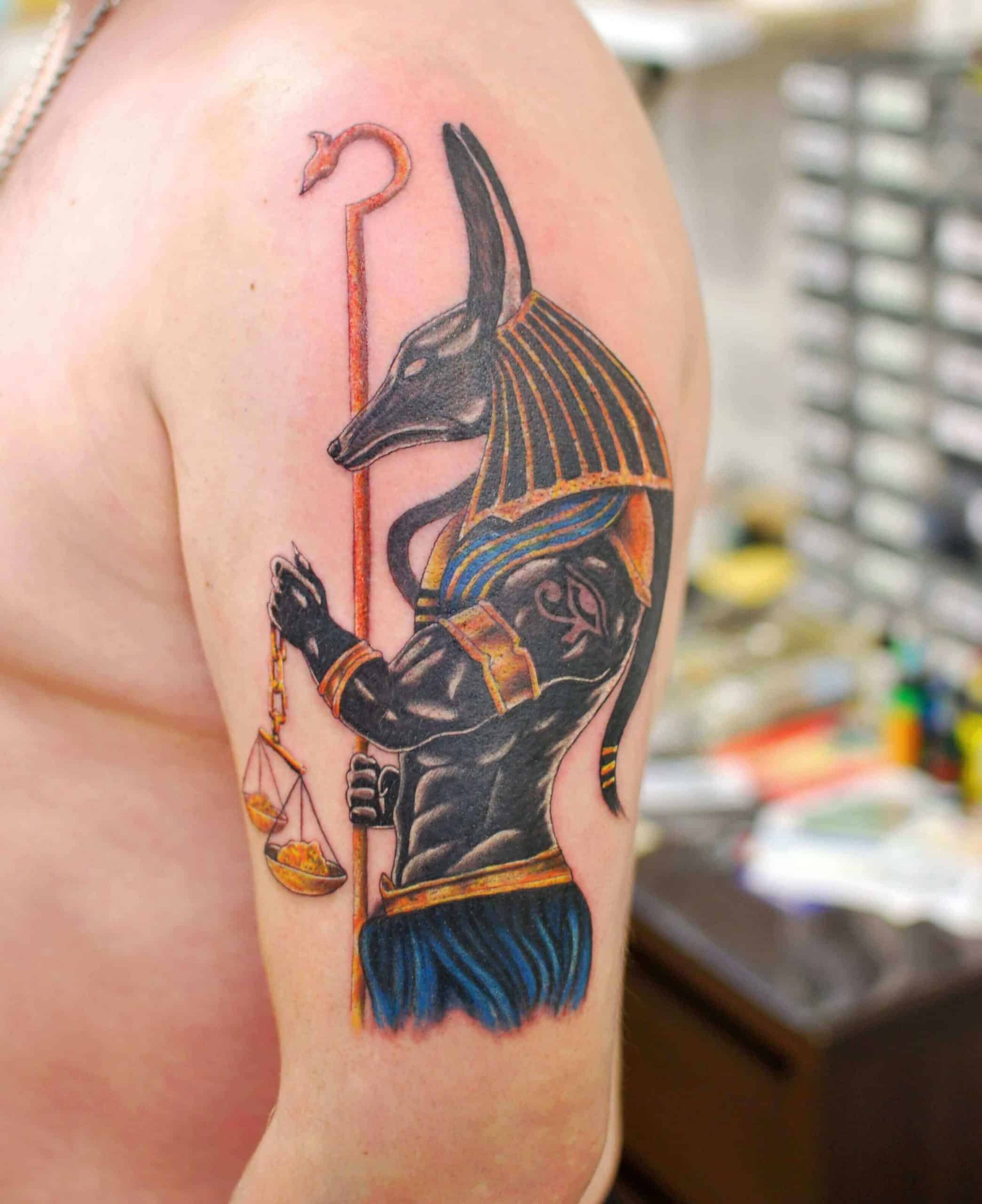 colored egyptian tattoo on arm