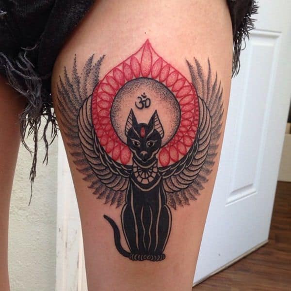 colored egyptian tattoo on thigh