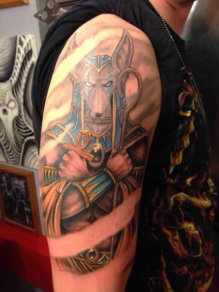 colored egyptian tattoo on arm