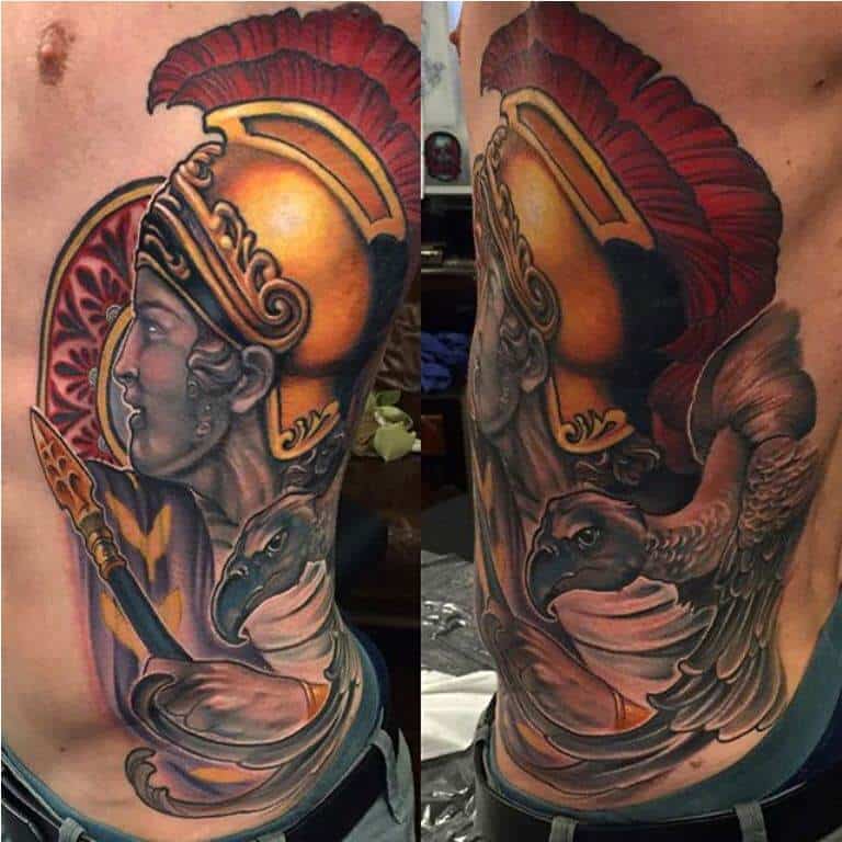 colored god of war tattoo on rib