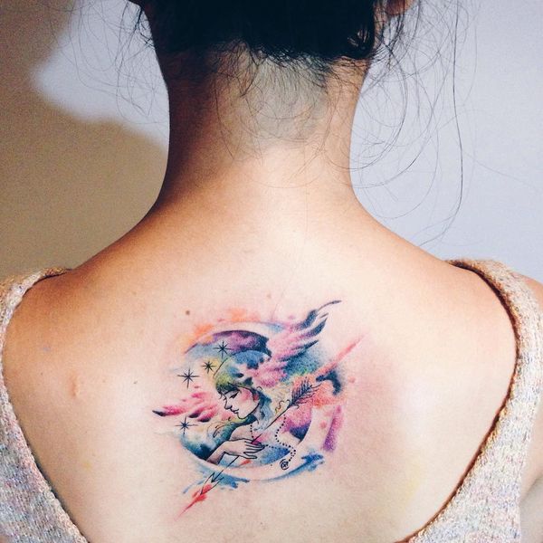 colored sagittarius tattoo on back