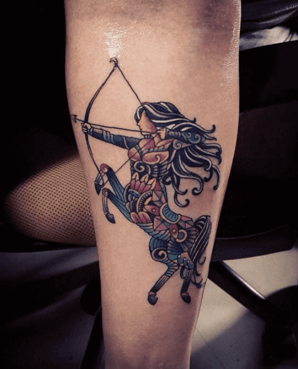 colored sagittarius tattoo on arm