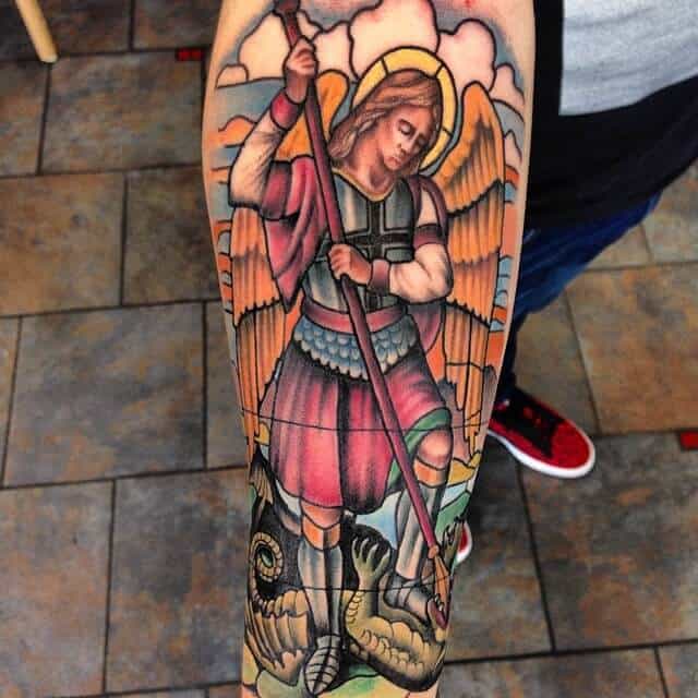 colored saint michael tattoo on arm