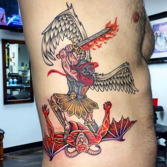 colored saint michael tattoo on rib