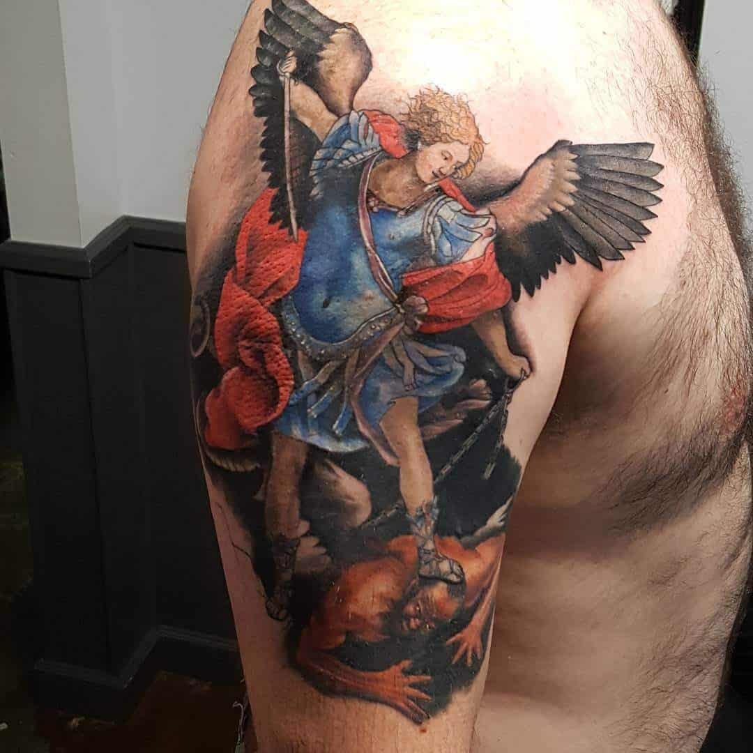 colored saint michael tattoo on arm