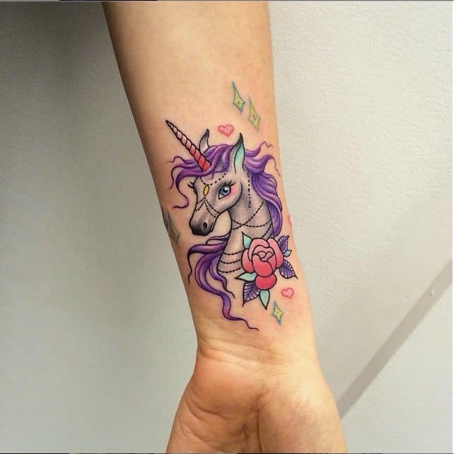 colorful unicorn tattoo on arm