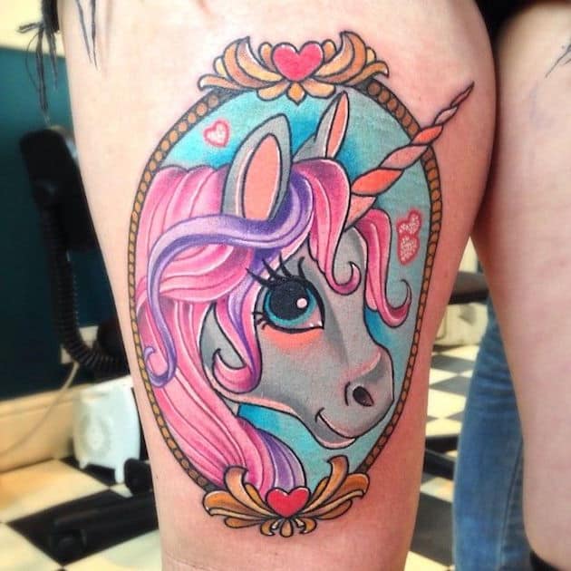 colorful unicorn tattoo on thigh