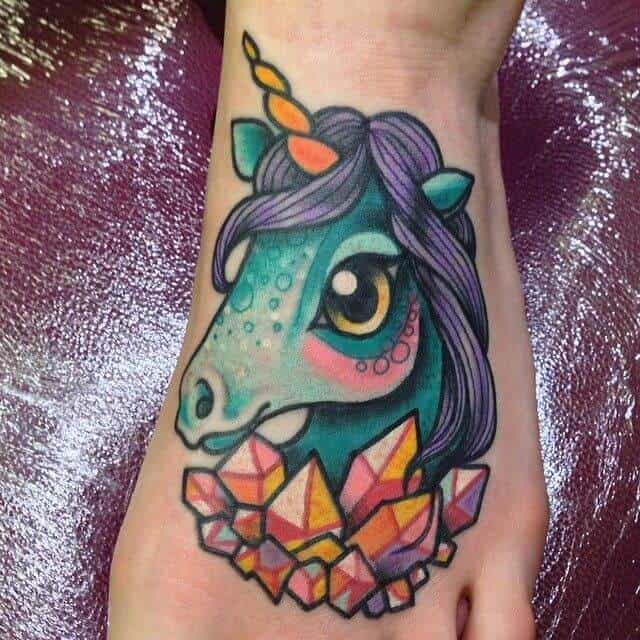 colorful unicorn tattoo on foot