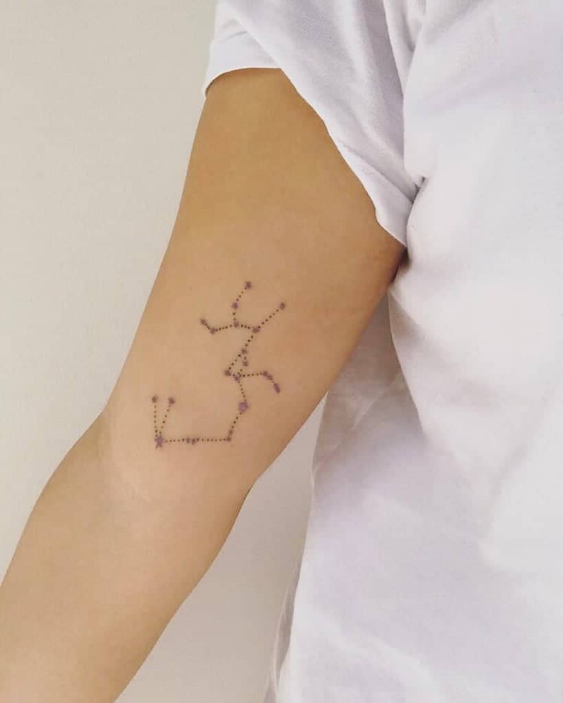 constellation sagittarius tattoo on arm.