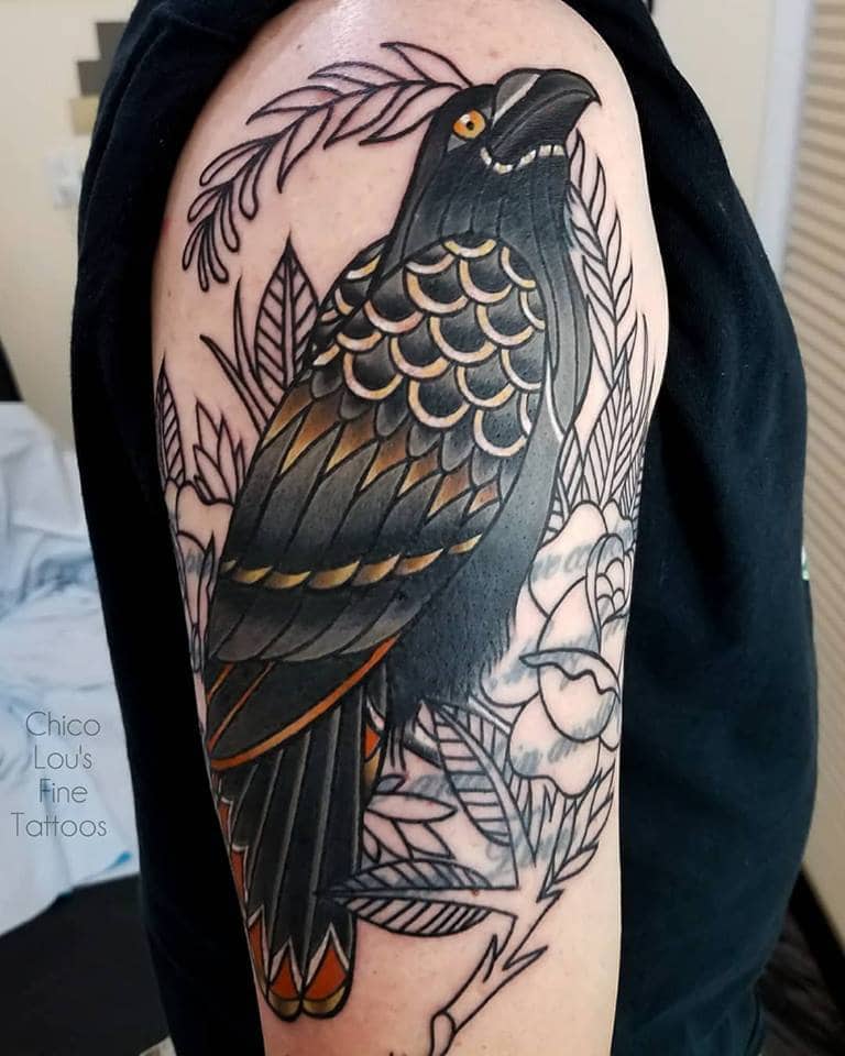 crow raven arm tattoo