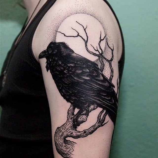 crow raven arm tattoo