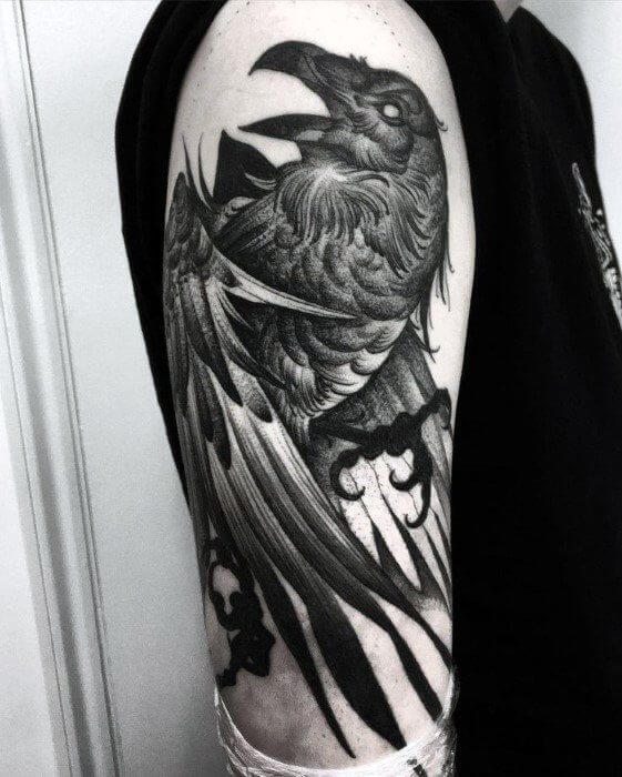 crow raven tattoo on arm