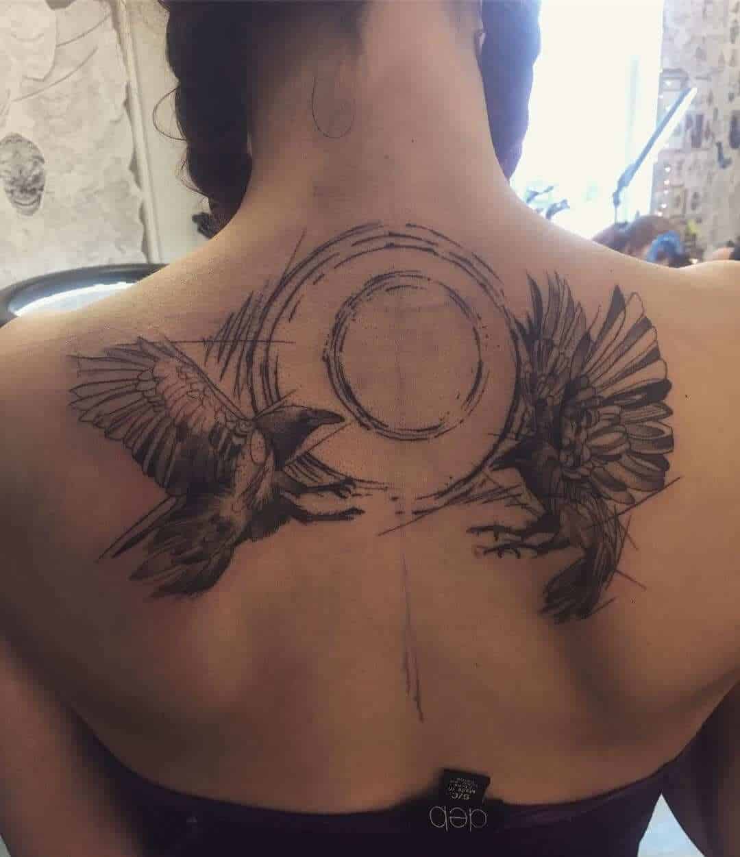 crow raven back tattoo