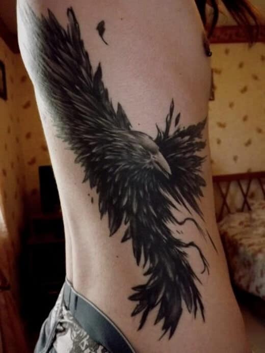 crow raven rib tattoo