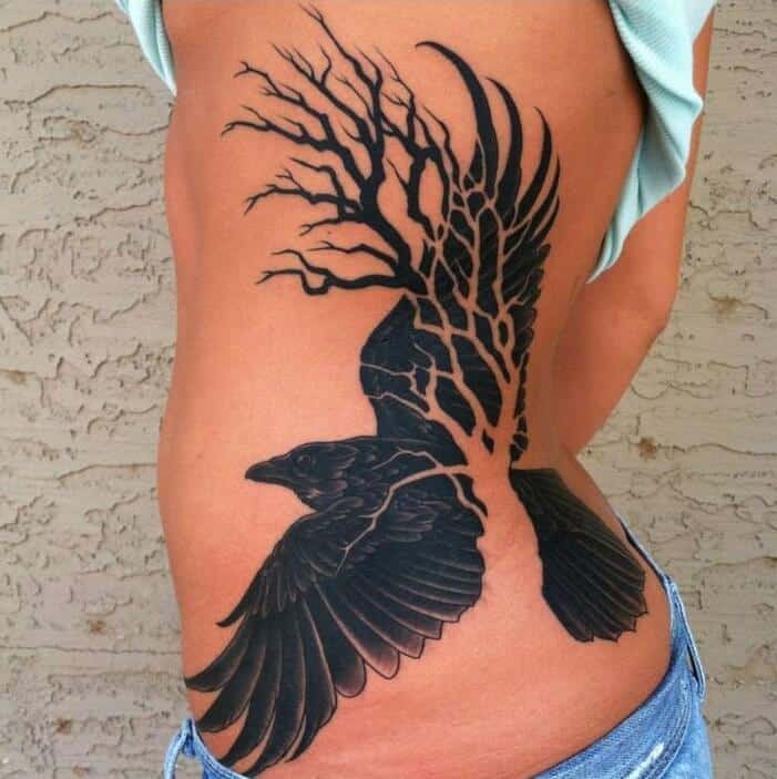 crow raven rib tattoo