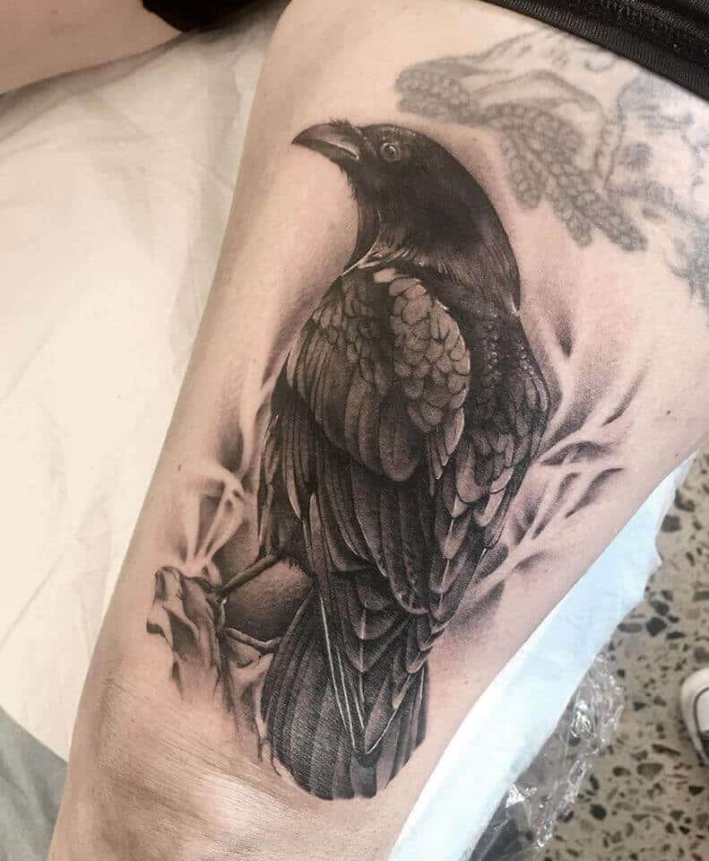 crow raven thigh tattoo