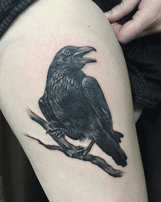 crow raven thigh tattoo