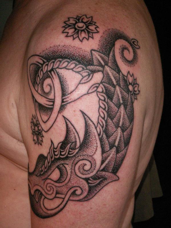 dragon celtic tattoo on arm