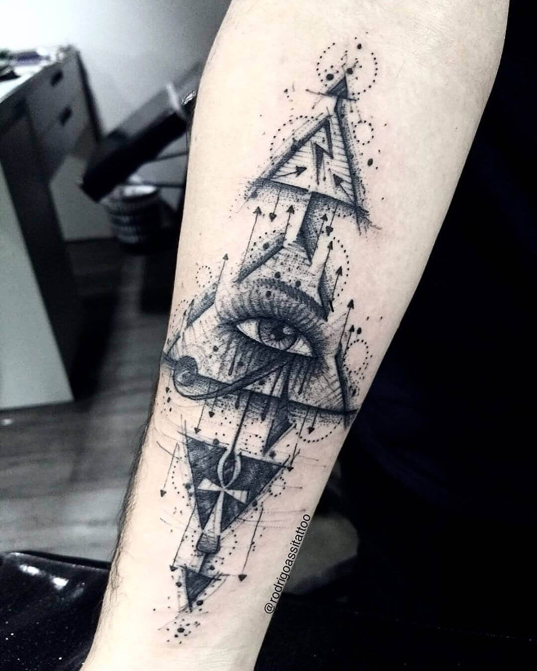 geometric eye of horus tattoo on arm