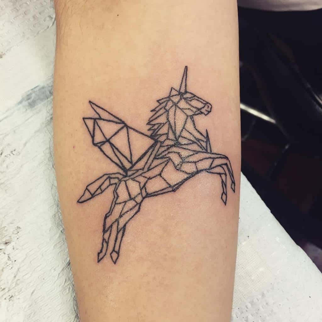geometric unicorn tattoo on arm