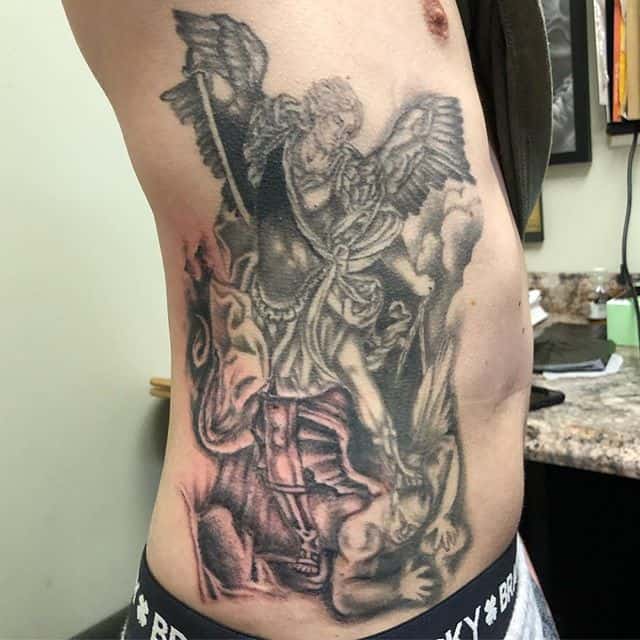 saint michael tattoo on rib