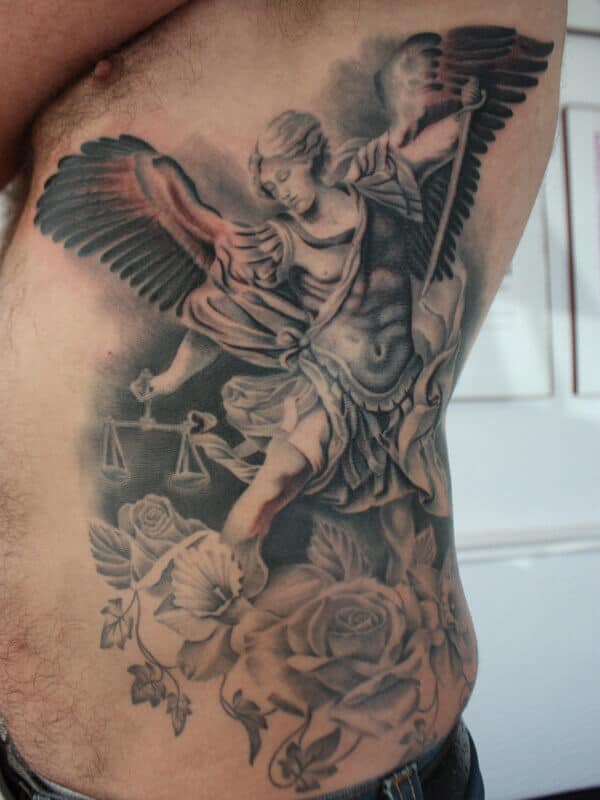 saint michael rib tattoo