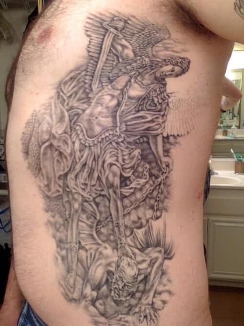 saint michael rib tattoo