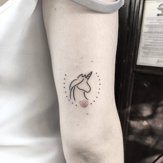 small unicorn tattoo on arm