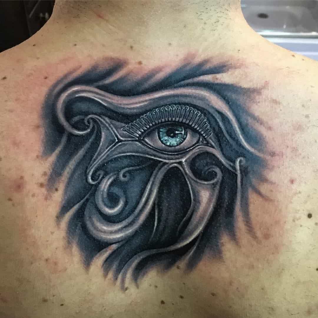 tribal eye of horus tattoo on back