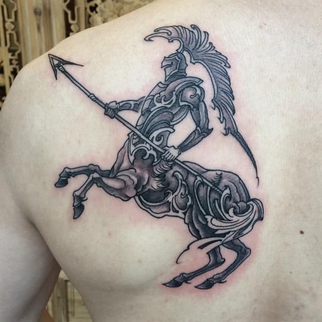 tribal sagittarius tattoo on back