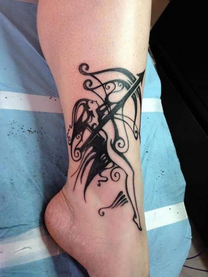 tribal sagittarius tattoo on leg