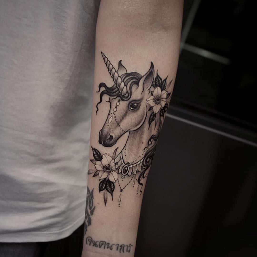 unicorn arm tattoo