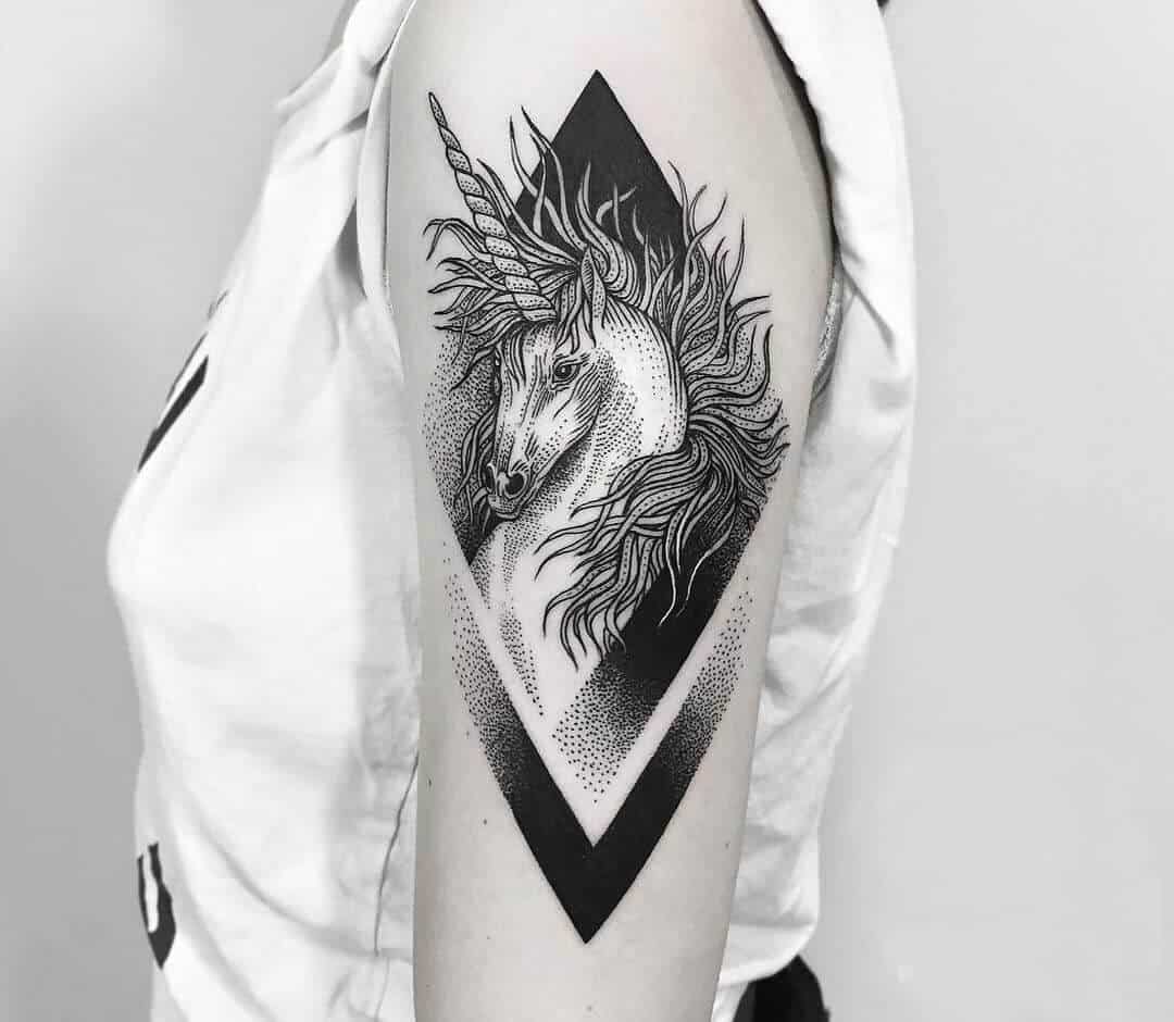 unicorn arm tattoo