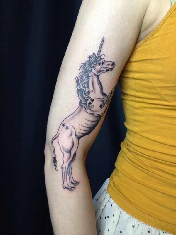 unicorn arm tattoo