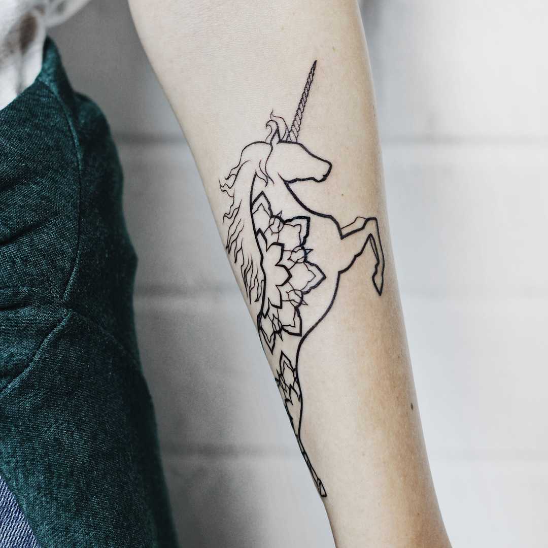 unicorn arm tattoo