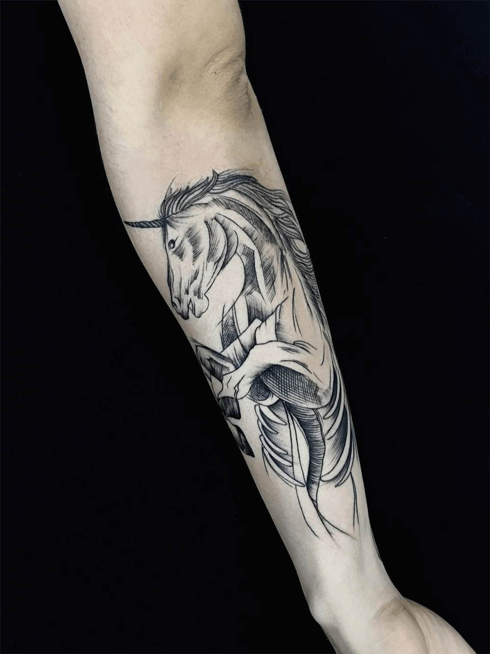 unicorn arm tattoo