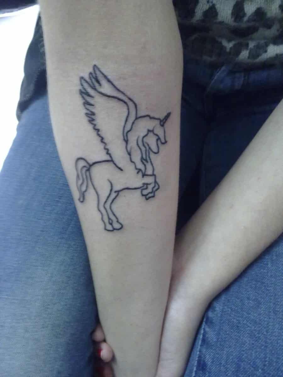 unicorn tattoo on arm