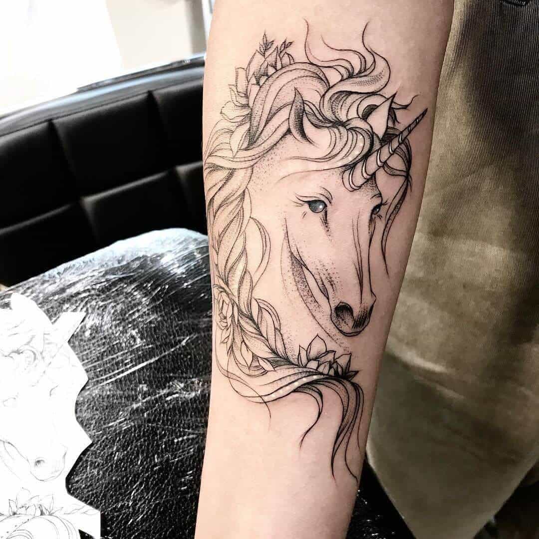 unicorn tattoo on arm