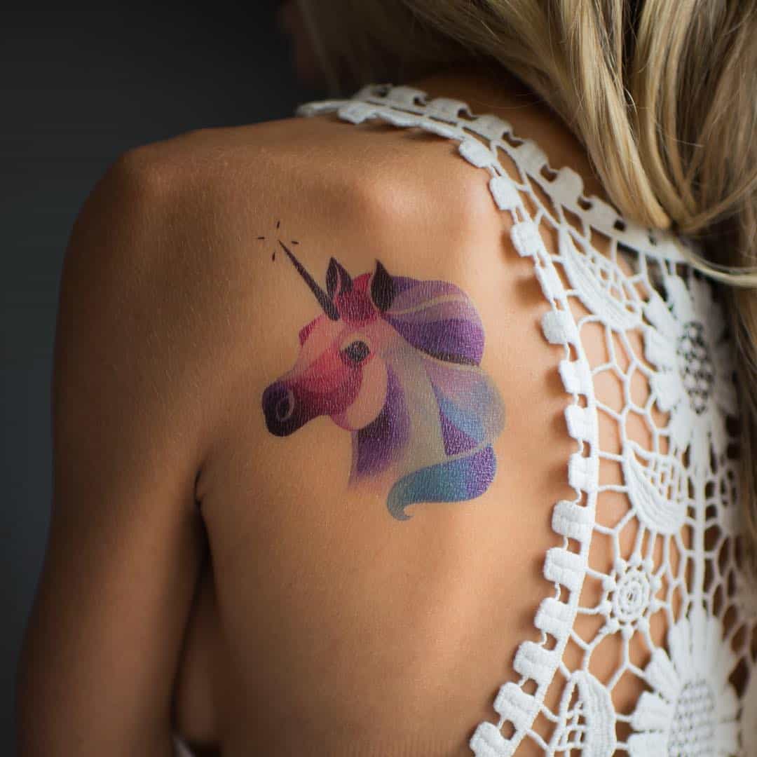 unicorn back tattoo