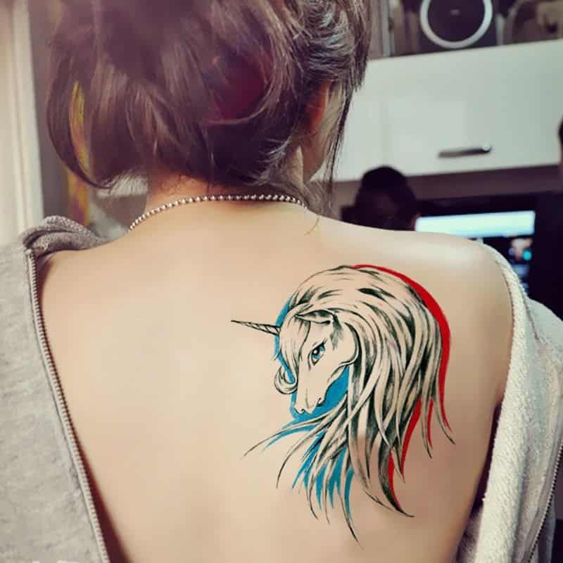 unicorn tattoo on back